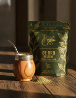 Load image into Gallery viewer, Mate starter kit lifestyle shot: mate gourd and bombilla with De Oro Reserve bag on rustic wood table