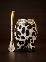 Load image into Gallery viewer, Editorial hero still-life of the cowhide torpedo mate gourd on a dark background