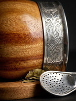 Load image into Gallery viewer, Craftsmanship macro detail of the glossy algarrobo mate gourd's wood grain and silver rim
