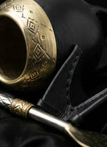 Load image into Gallery viewer, Craftsmanship macro detail of the black torpedo mate gourd's leather and engraved gold rim